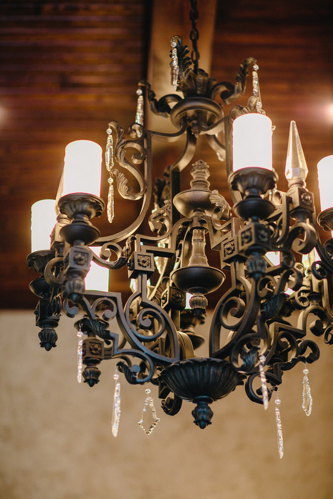 Black chandelier. Cute Coral Gray wedding at Briscoe Manor, Houston, by Luke and Cat Photography