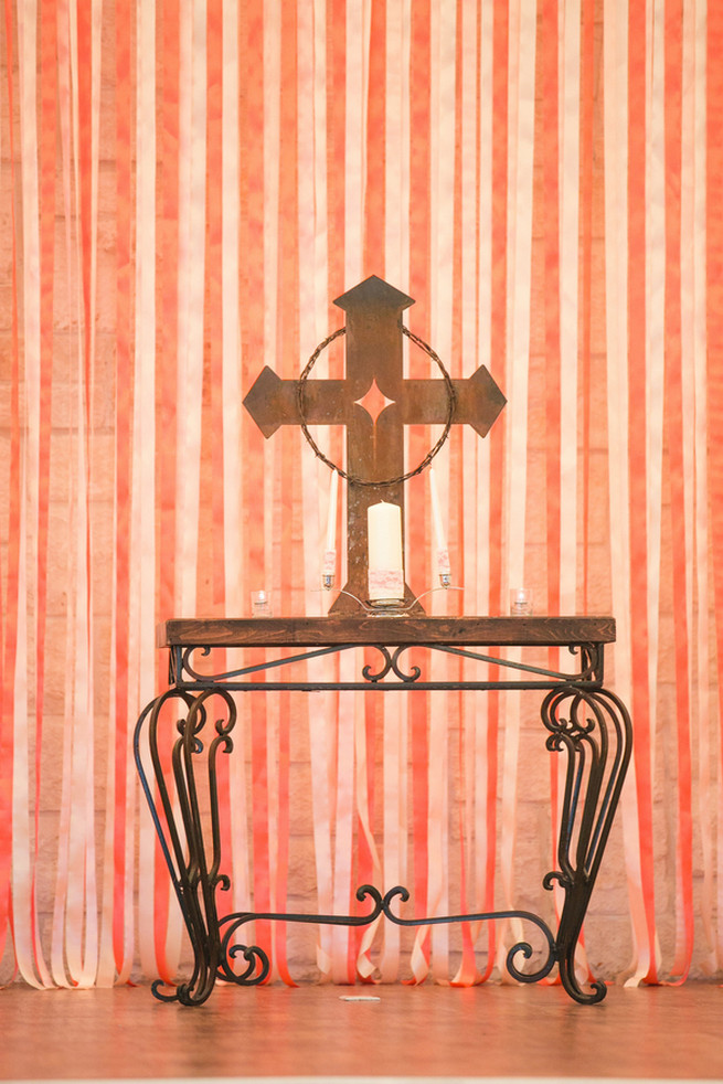 Rustic cross in chapel. Cute Coral Gray wedding at Briscoe Manor, Houston, by Luke and Cat Photography