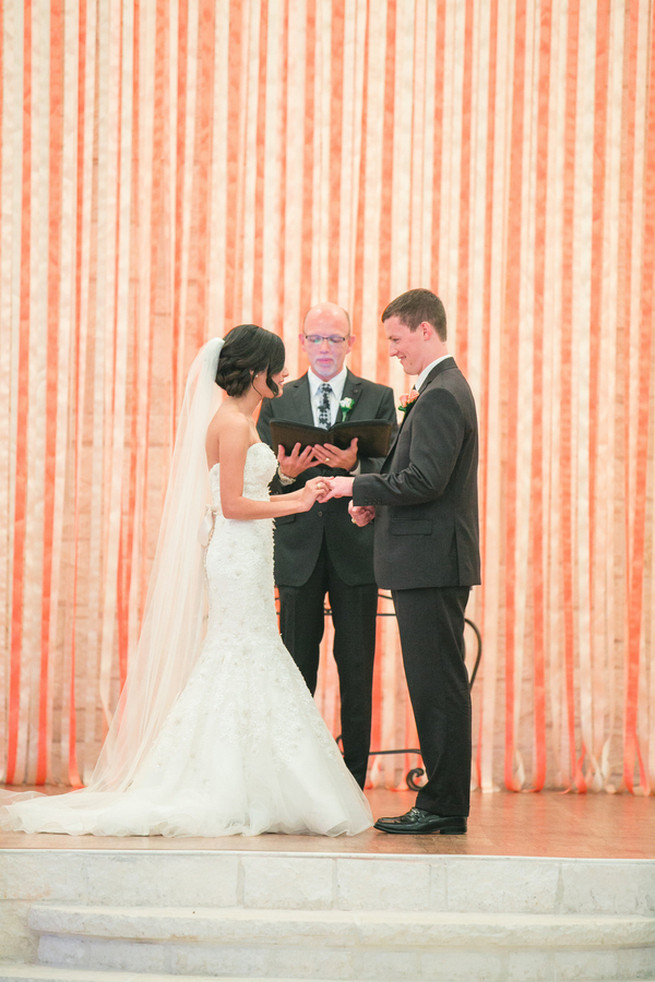 Diy ribbon ceremony backdrop. Cute Coral Gray wedding at Briscoe Manor, Houston, by Luke and Cat Photography