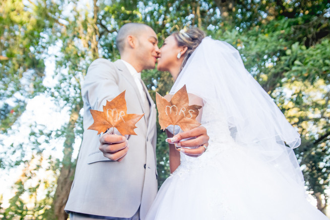 Mr and Mrs on autumn leaves wedding photo idea. DIY Pastel Wedding - Conway Photography