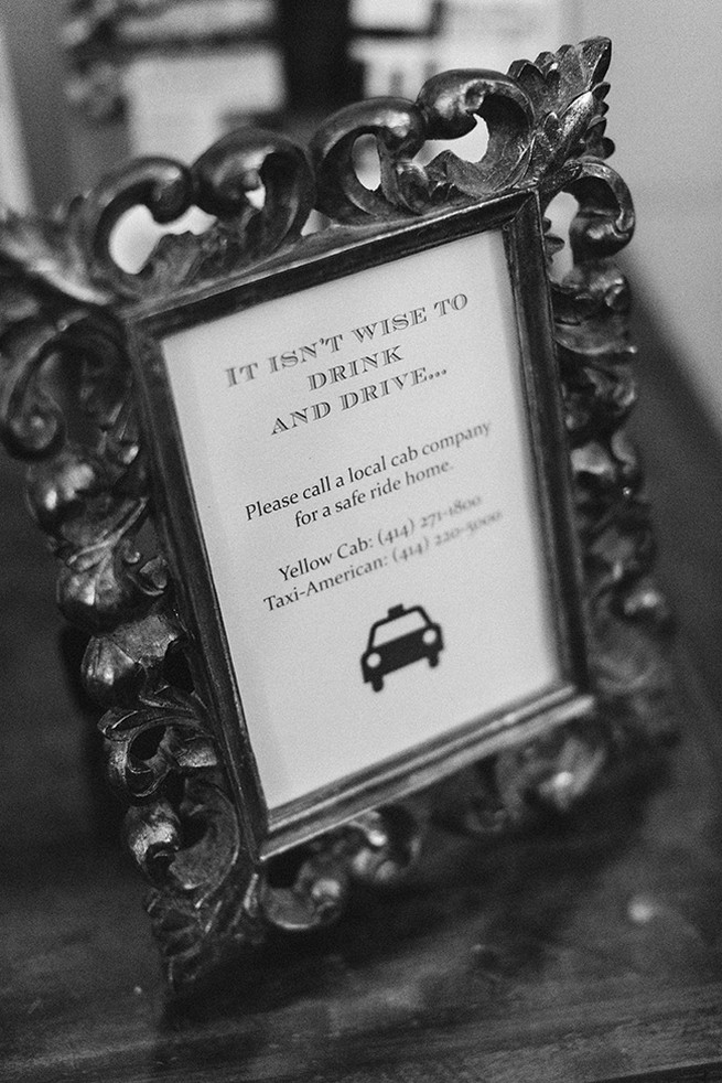 Dont drink and drive sign for wedding guests in frame on tables. / Elegant Milwaukee Wedding Valo Photography