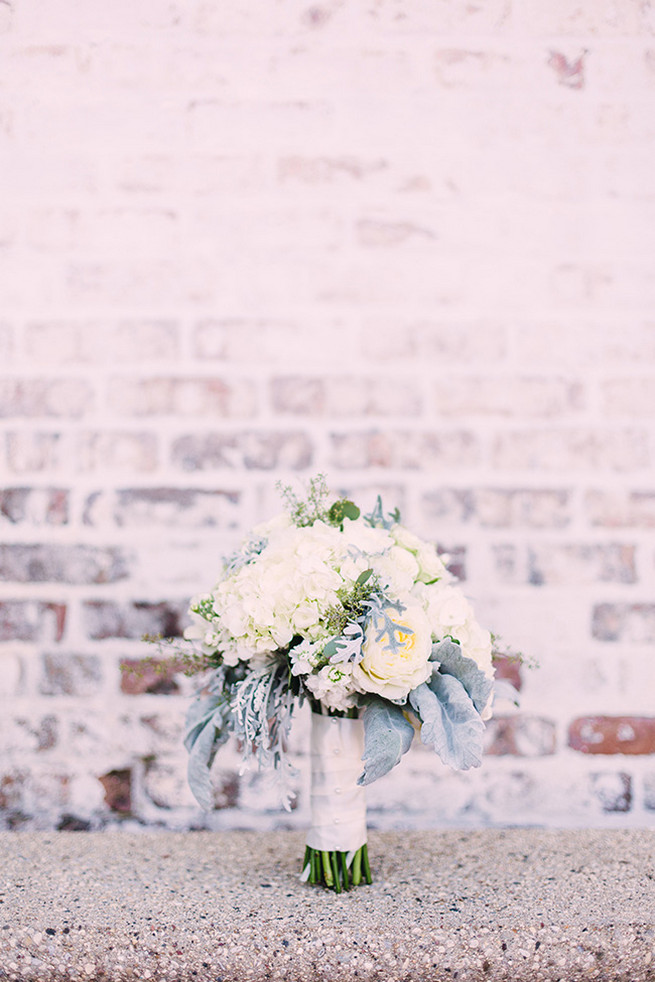 Romantic wedding bouquet of white hydrangea, white garden roeses, peony, dusty miller and lambs ear with white bouquet wrap. / Alyssa Kristin's Elegant Milwaukee Wedding Valo Photography