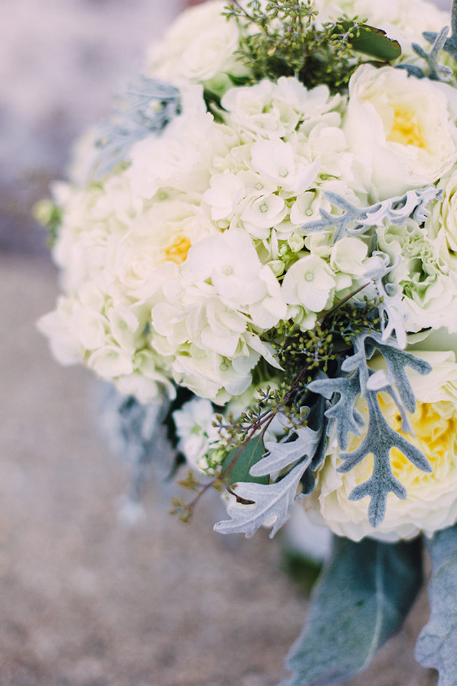 Romantic wedding bouquet of white hydrangea, white garden roeses, peony, dusty miller and lambs ear with white bouquet wrap. / Elegant Milwaukee Wedding Valo Photography