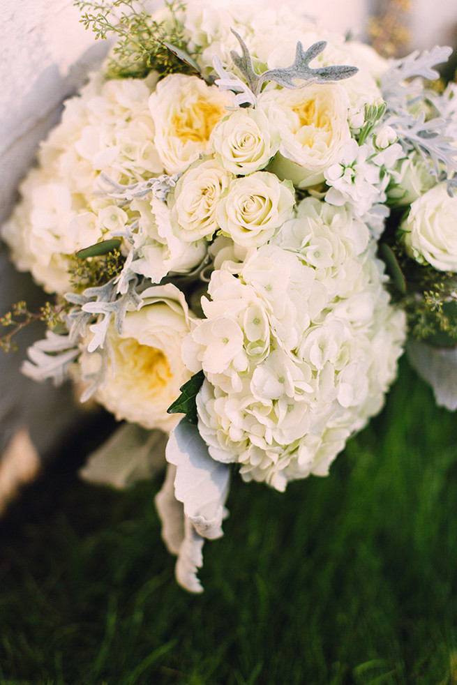 Romantic wedding bouquet of white hydrangea, white garden roeses, peony, dusty miller and lambs ear with white bouquet wrap. / Alyssa Kristin's Elegant Milwaukee Wedding Valo Photography