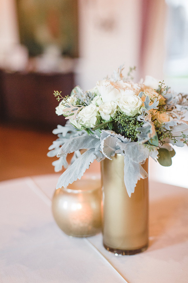 DIY painted gold vases with re-purposed bridesmaids bouquets of cream roses and dusty miller. / Elegant Milwaukee Wedding Valo Photography