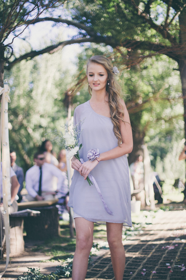 Bridesmaid in grey off the short short dress and three white flowers. Grey White Farm Wedding, South Africa // Maryke Albertyn