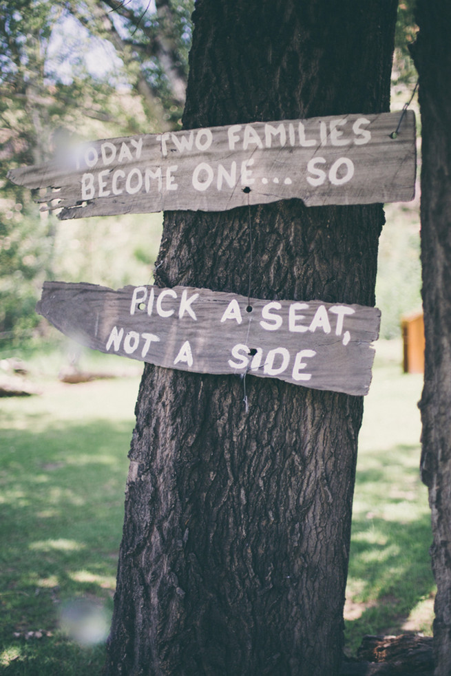 Pick a seat not a side wooden wedding sign in tree.