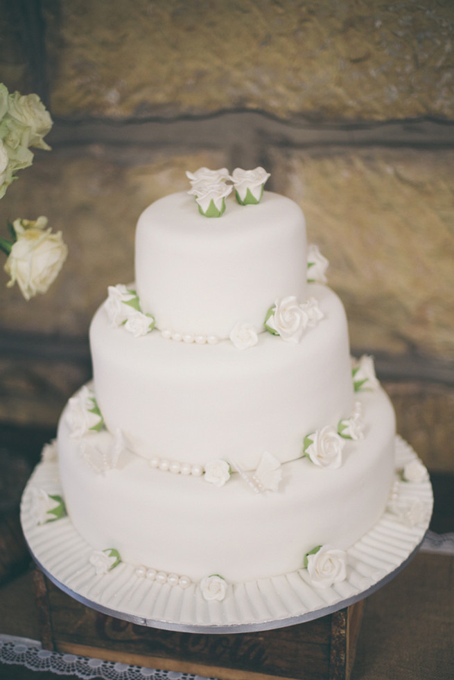 White wedding cake with roses. Grey White Farm Wedding, South Africa // Maryke Albertyn