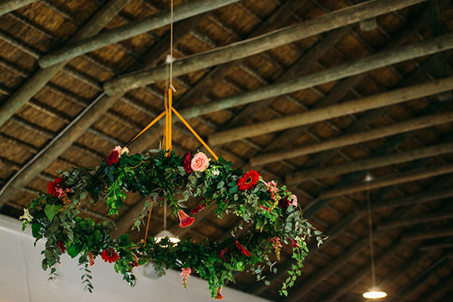 Floral chandelier. Woodlands Winter Wedding in deep blue, burgundy and emerald green // Knit Together Photography