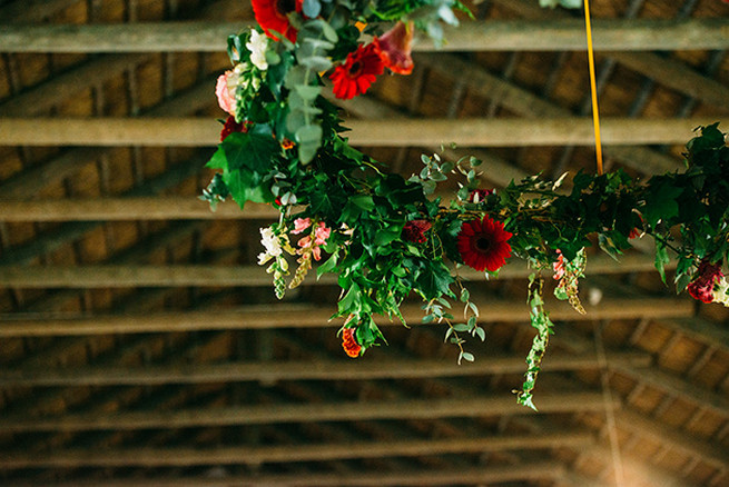 Floral chandelier. Woodlands Winter Wedding in deep blue, burgundy and emerald green // Knit Together Photography