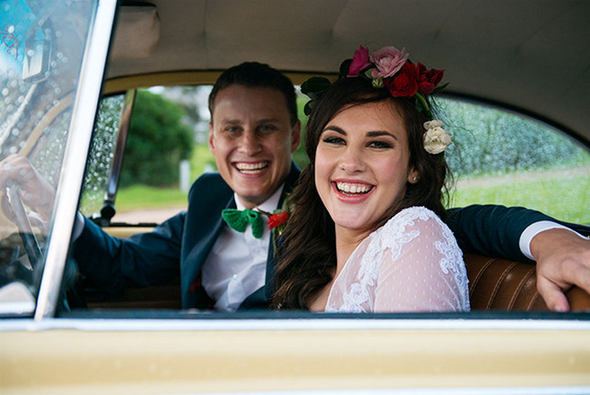  Bride and groom leaving in vintage Volkswagen Beetle. Woodlands Winter Wedding in deep blue, burgundy and emerald green // Knit Together Photography