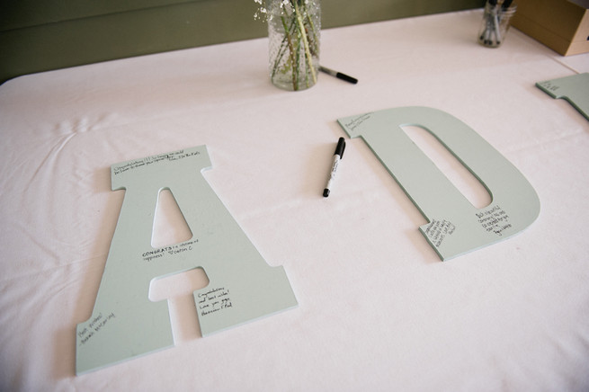 Guest Book Idea - couples surname spelled out on board, signed by guests, then framed afterward.