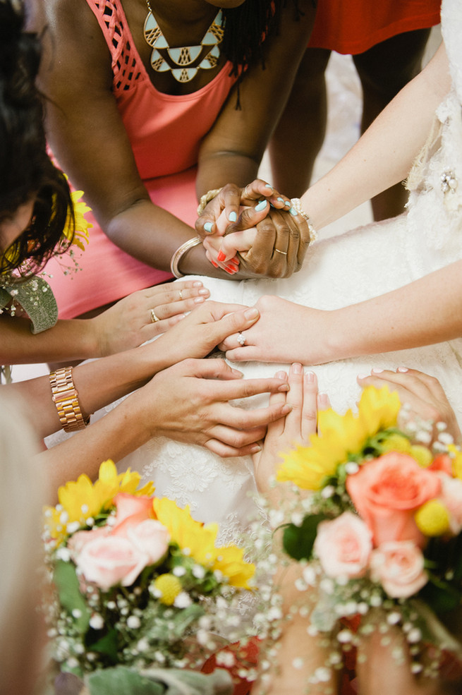 Bride praying with bridesmaids. Coral Navy Mustard Wedding / Meredith McKee Photography