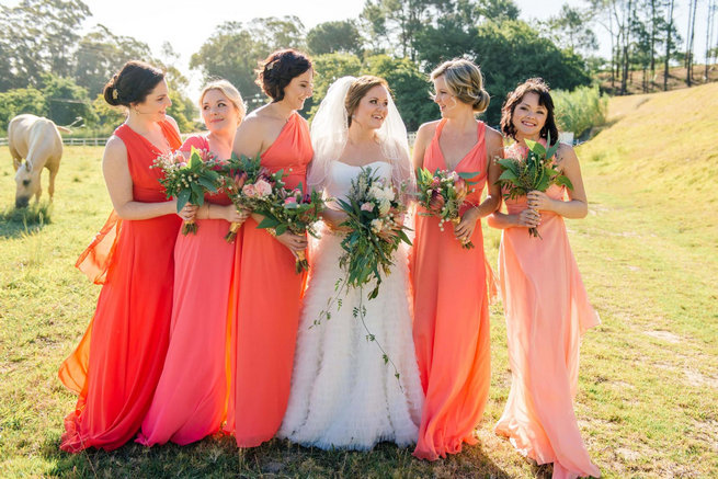 Peach coral mismatched bridesmaid dresses // Langkloof Roses Wedding, Cape Town - Claire Thomson Photography