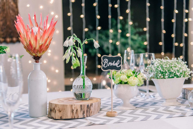 Naked bulbs and proteas with chevron runner // Langkloof Roses Wedding, Cape Town - Claire Thomson Photography