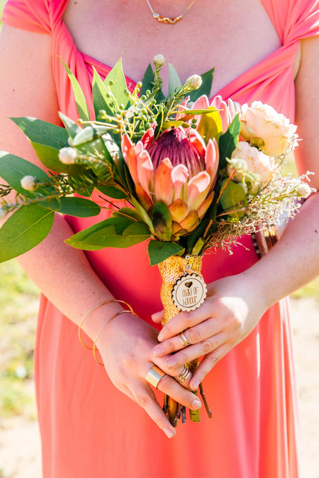 Protea Bouquet and peach bridesmaid dress /Langkloof Roses Wedding, Cape Town - Claire Thomson Photography