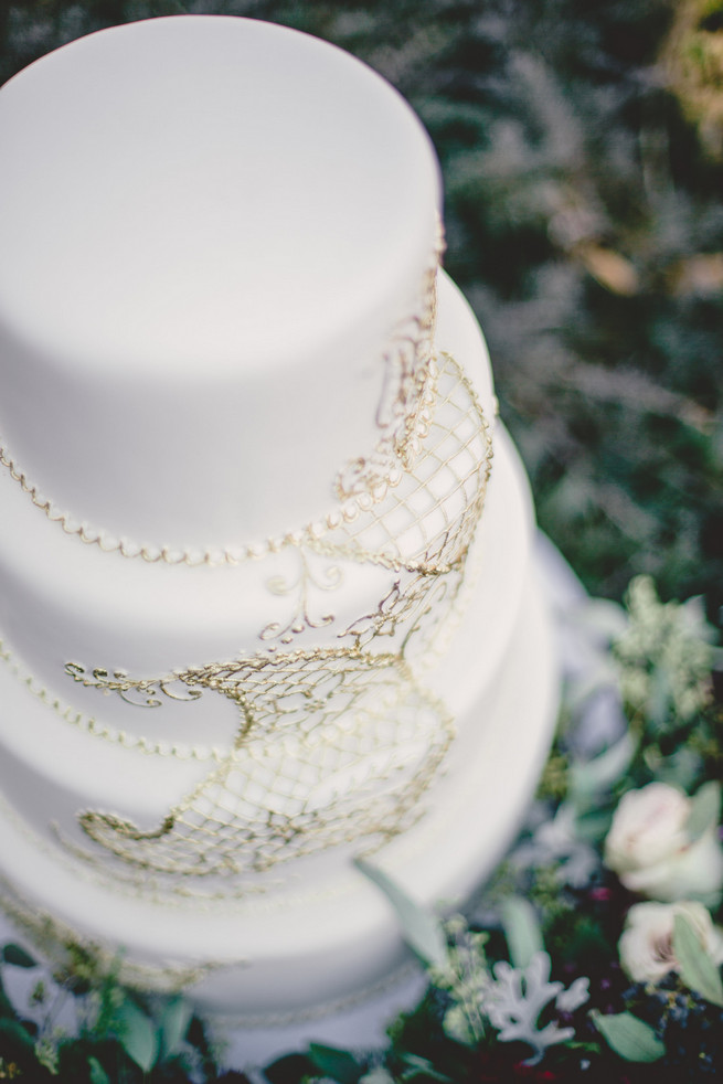 White wedding cake with gold applique Marsala Wedding Tablescape - RedboatPhotography.net