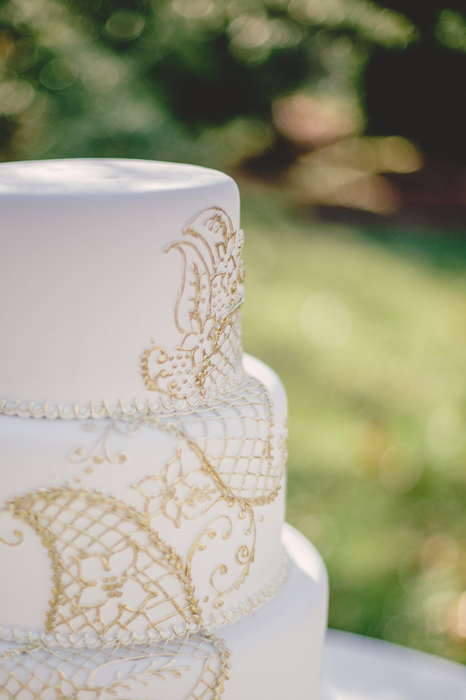 White wedding cake with gold applique Marsala Wedding Tablescape - RedboatPhotography.net