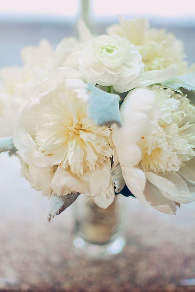 All white wedding bouquet of roses, peony, ranunculus and lambs ear