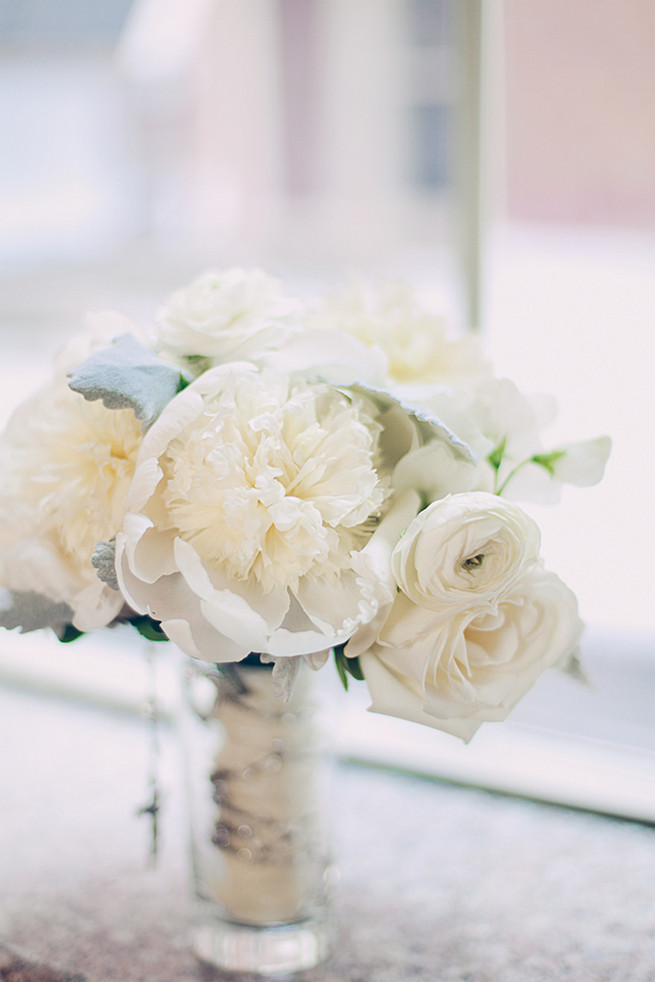 All white wedding bouquet of roses, peony, ranunculus and lambs ear
