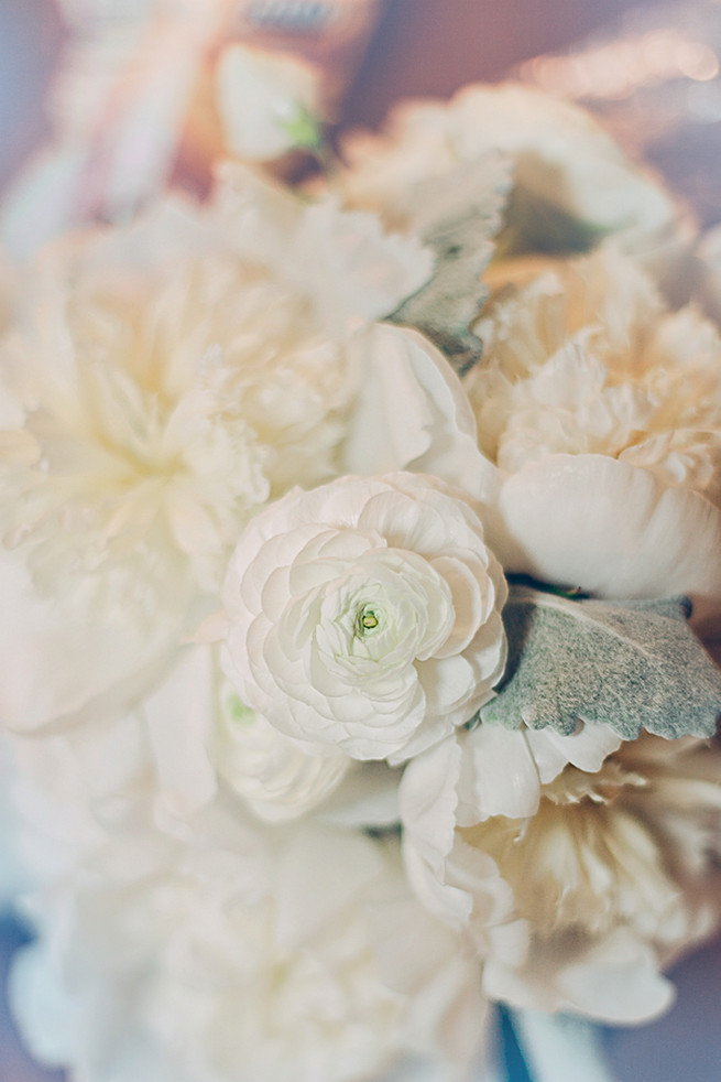 All white wedding bouquet of roses, peony, ranunculus and lambs ear