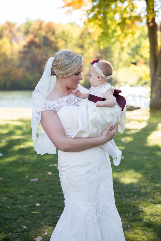 Bride with flower girl  - Beautiful Burgundy and Tan Wedding - Molinski Photo