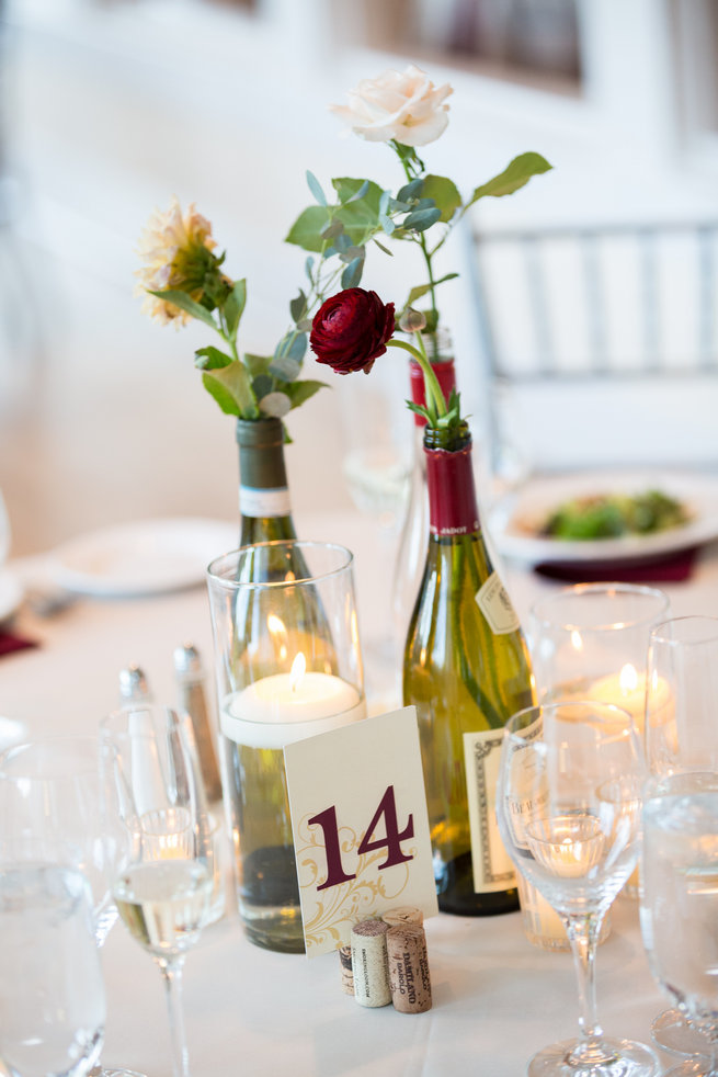 Wine and cheese themed wedding - wine bottles with flowers - Beautiful Burgundy and Tan Wedding - Molinski Photo