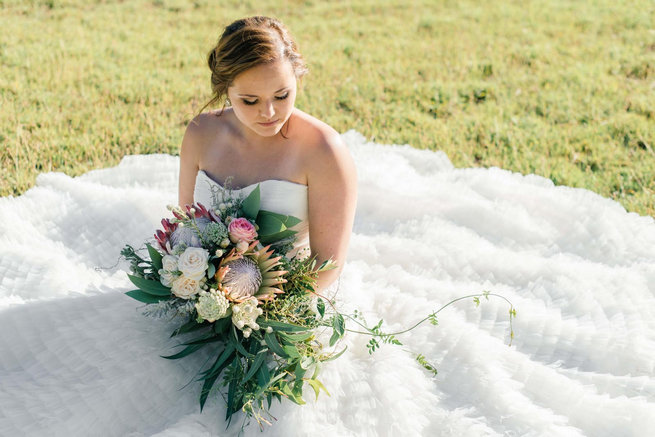 Get this Cascading Protea Bouquet Recipe in the article. Photography by Claire Thomson.