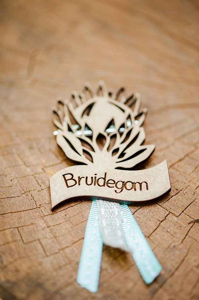 Bruidegom laser cut wood Protea pin. Coral and Green South African Wedding // D'amor Photography