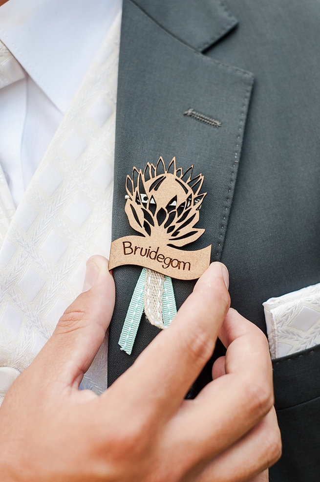 Bruidegom laser cut wood Protea pin. Coral and Green South African Wedding // D'amor Photography