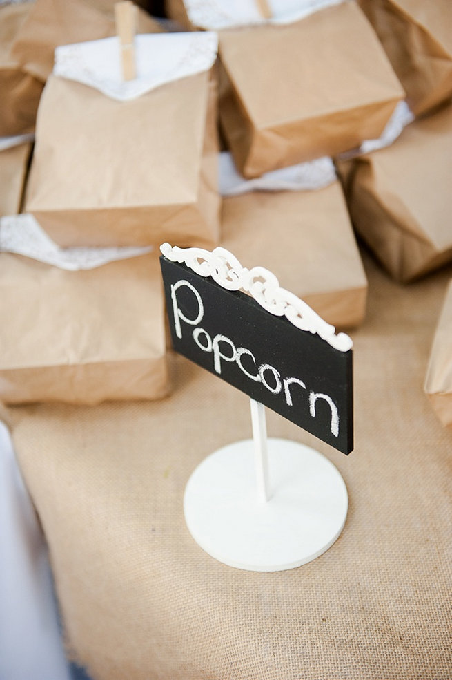 Brown paper favor bags with doily and clothes peg popcorn favors / Coral and Green South African Wedding // D'amor Photography