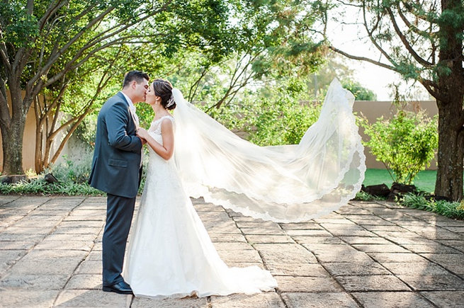 Veil caught in breeze / Coral and Green South African Wedding // D'amor Photography