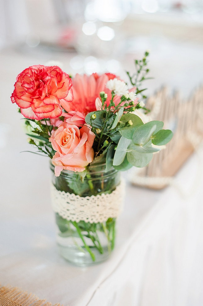 Peach carnation, peach rose and eucalyptus in jar wrapped with lace / Coral and Green South African Wedding // D'amor Photography