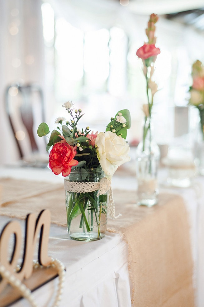 Peach carnation, peach rose and eucalyptus in jar wrapped with lace / Coral and Green South African Wedding // D'amor Photography