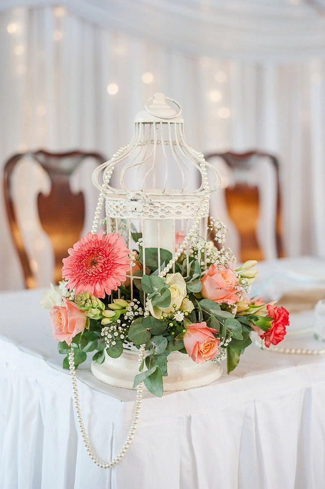 White birdcage with peach and green flowers / Coral and Green South African Wedding // D'amor Photography