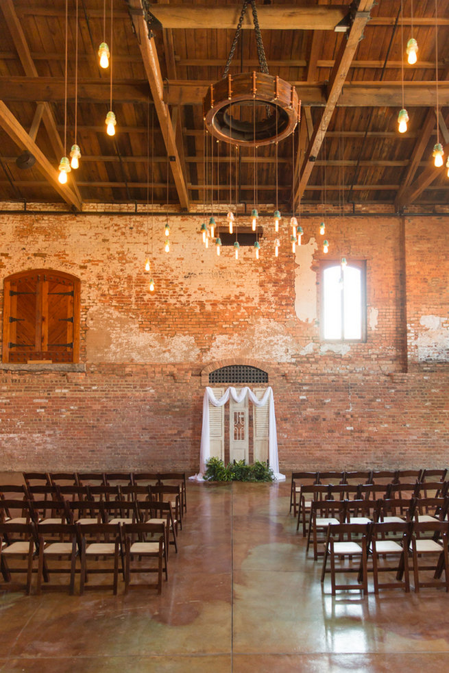 Modern warehouse ceremony location. Modern Urban Wedding at Old Cigar Warehouse / Ryan and Alyssa Photography