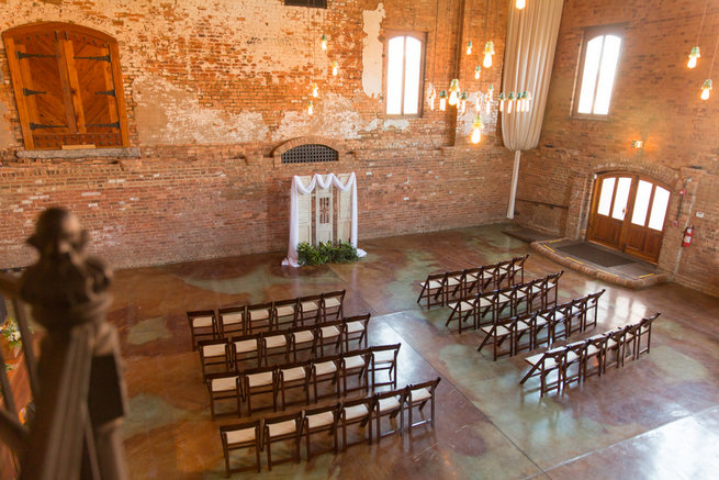 Modern warehouse ceremony location. Modern Urban Wedding at Old Cigar Warehouse / Ryan and Alyssa Photography