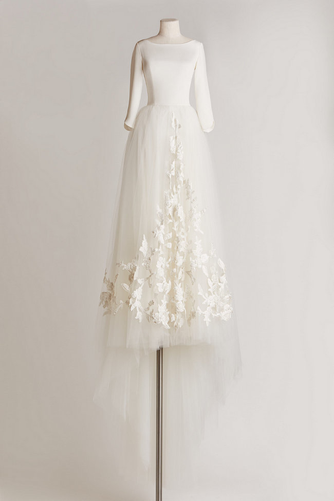  Chic, Sophisticated Wedding Dresses for Romantics: This stunning Grace gown strikes a balance of sophistication and utter romance with its crisp, ivory silk crepe top, embroidered tulle skirt, and a dainty button back.