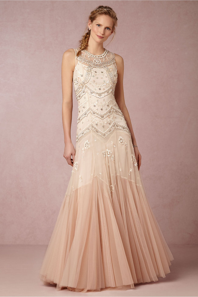 Chic, Sophisticated Wedding Dresses for Romantics: From the tiered layers of rose-hued ombre tulle to the tonal sequins and silver-cut beads, this stunning, contemporary gown has a head-turning silhouette that's perfect for the bride looking for something a bit unconventional.