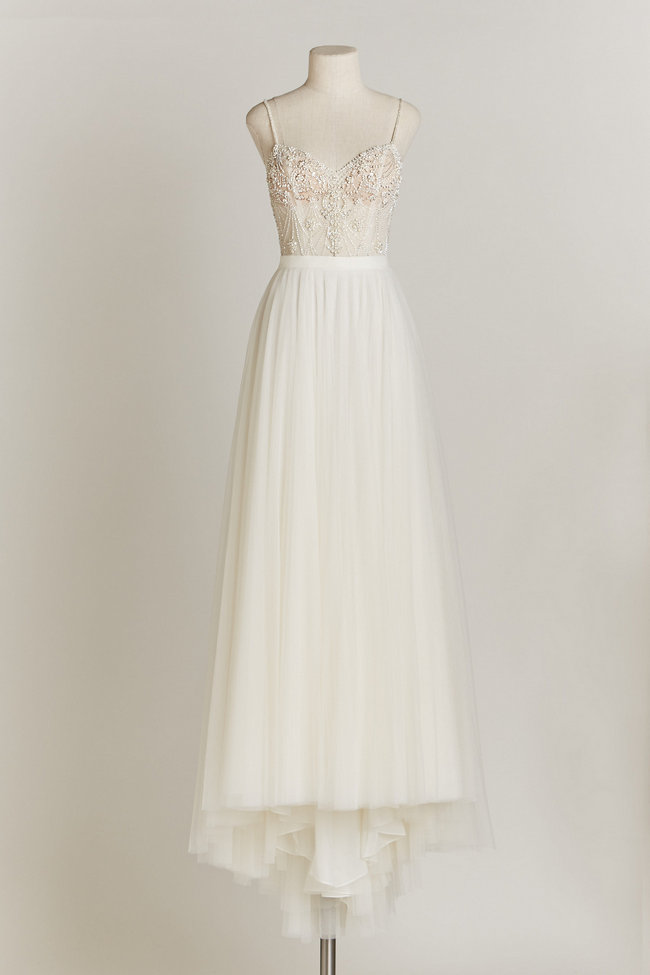 Chic Sophisticated Wedding Dresses for Romantics: The stunning and the meticulously hand-beaded Ella bodysuit featuring iridescent opals and glass beads, under the Amora Skirt with layers of airy, ivory tulle.