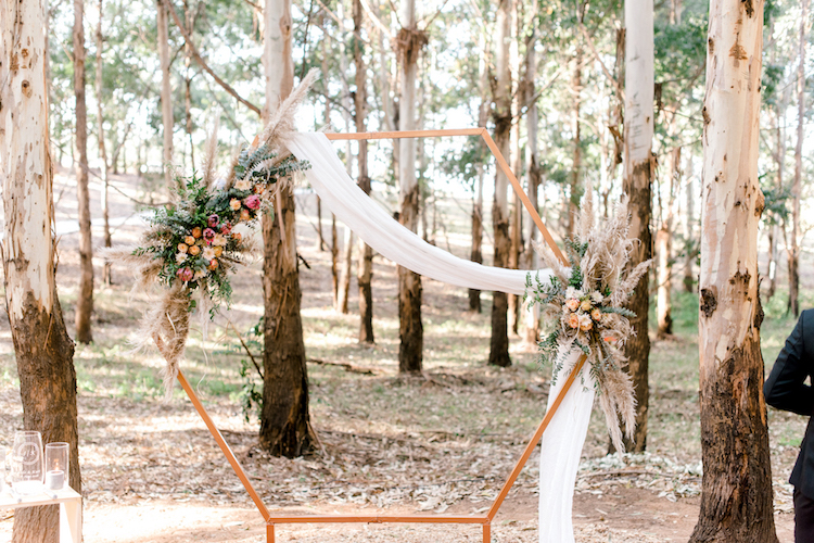 Forest Wedding with Geometric Wedding Arch and pampas grass