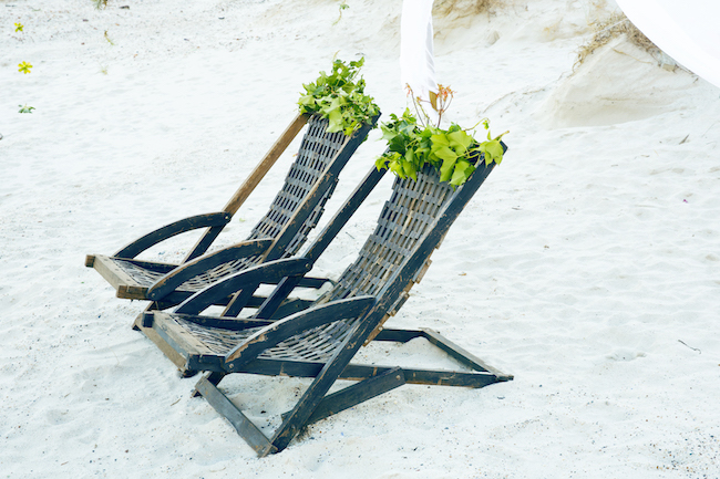 Boho beach wedding reception chairs and decor