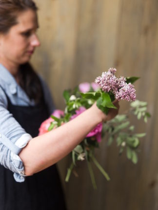 Step by step instructions with pictures: how to create a romantic, hand tied garden wedding bouquet.