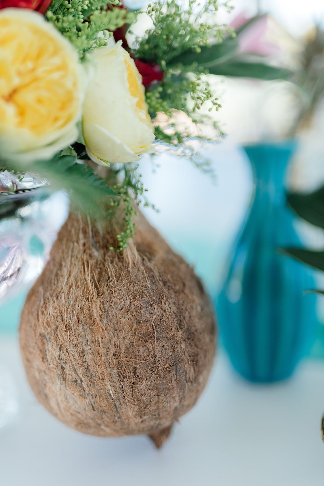 A coconut style vase for tropical flowers. Click for the most absolutely gorgeous Tropical Wedding ideas ever!