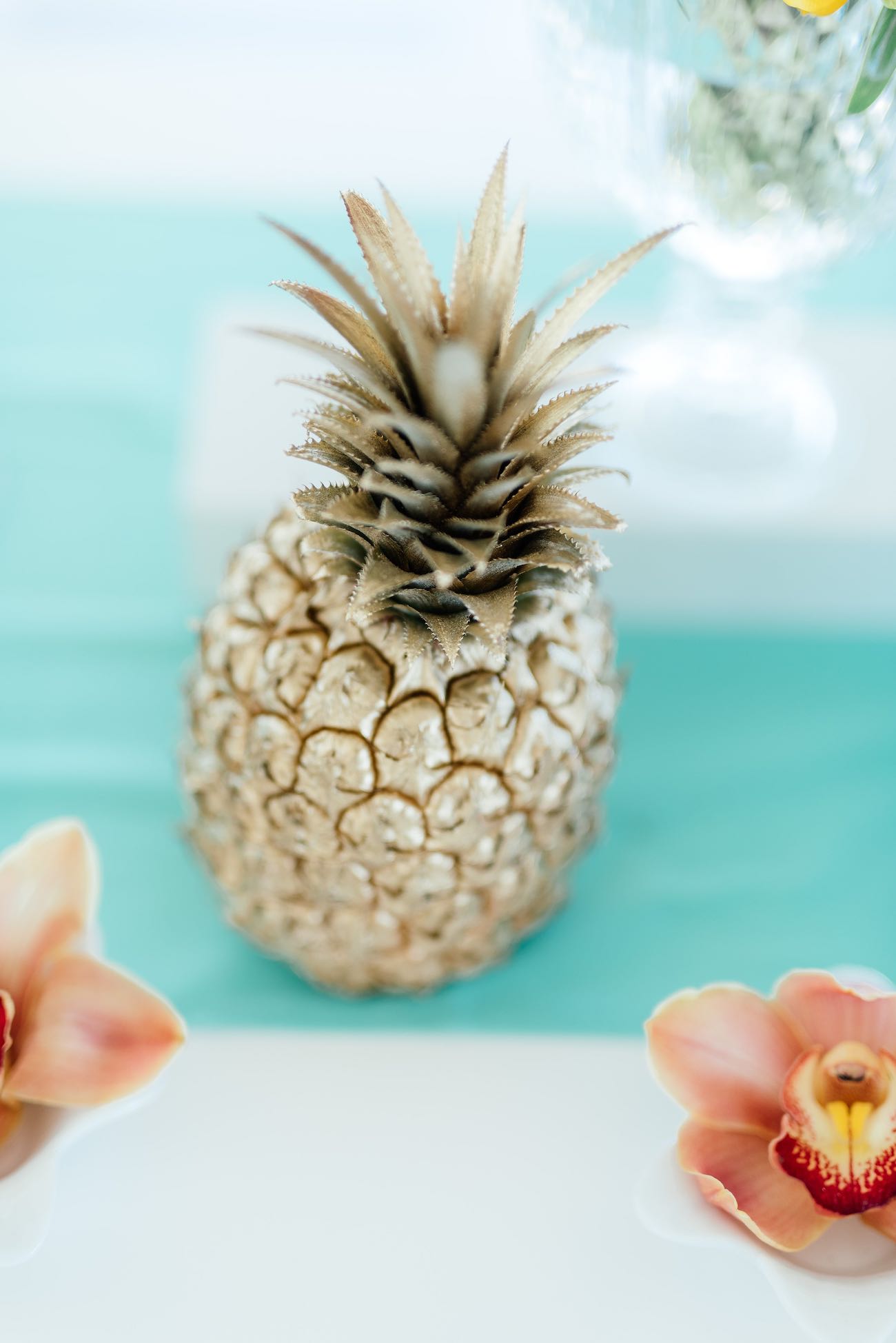 Gold painted pineapple. Click for the most absolutely gorgeous Tropical Wedding ideas ever!